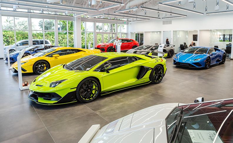 A Lamborghini car dealership will often have lots of clean windows